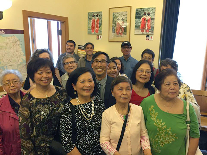 Supervisor Eric Mar (center) poses with artists from the Richmond Senior Center. Their work is currently on display in Mar's City Hall office through September.