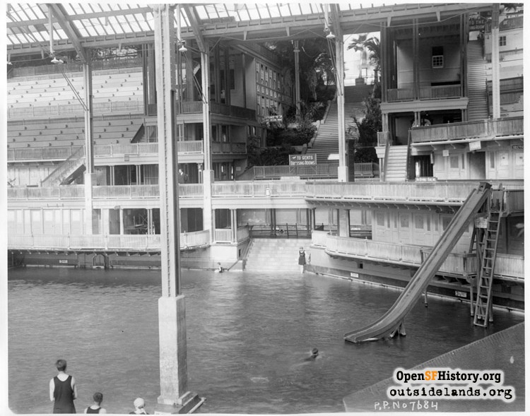 Sutro Baths. Looking east over main pool towards grand staircase, c1920. Plunge pool barely visible at center. Slide at right. Courtesy of openhistorysf.org