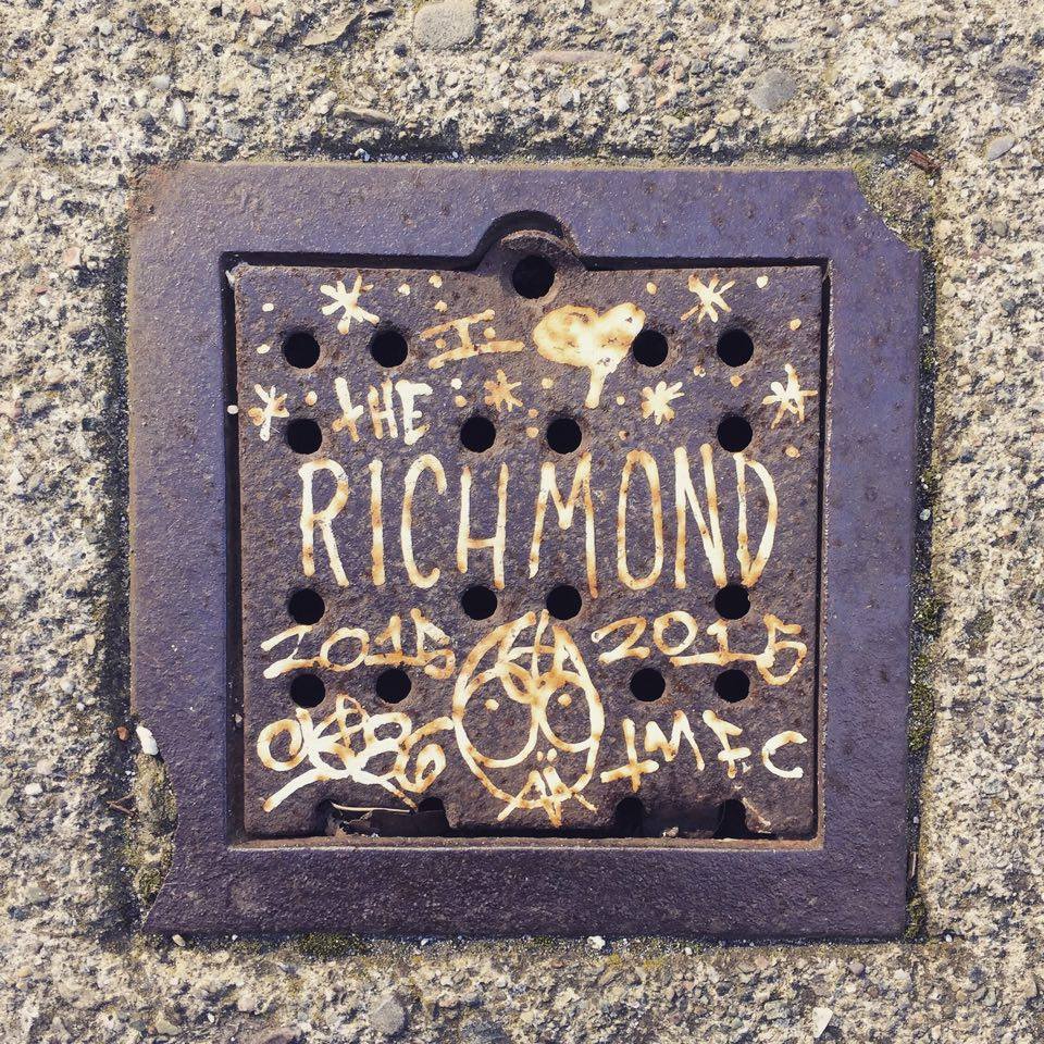 Someone got artsy on a drain cover at 16th & Calif. Photo by Cliff R.