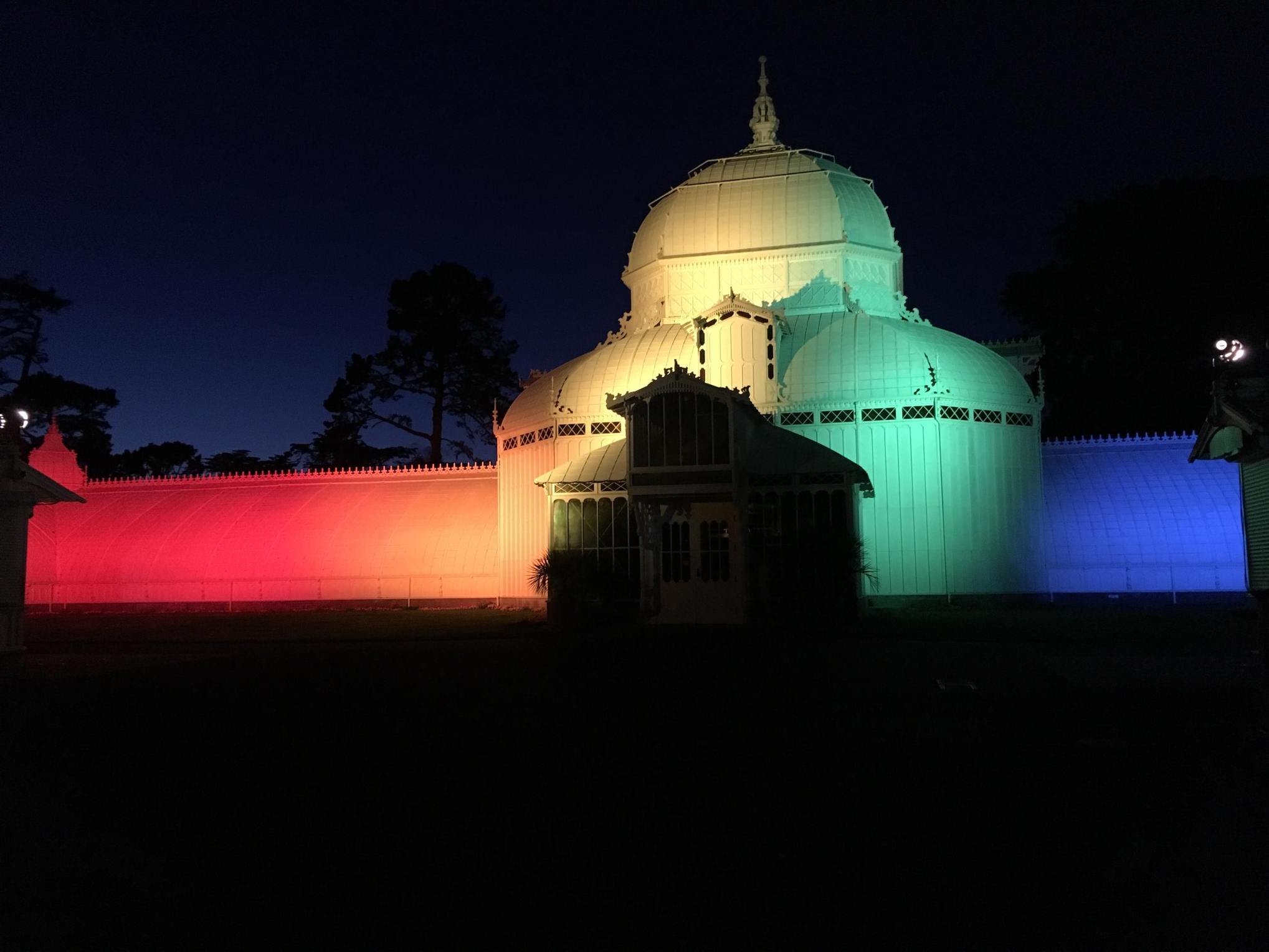 The Conservatory of Flowers has been lit up in rainbow colors in honor of LGBTQ Pride Month