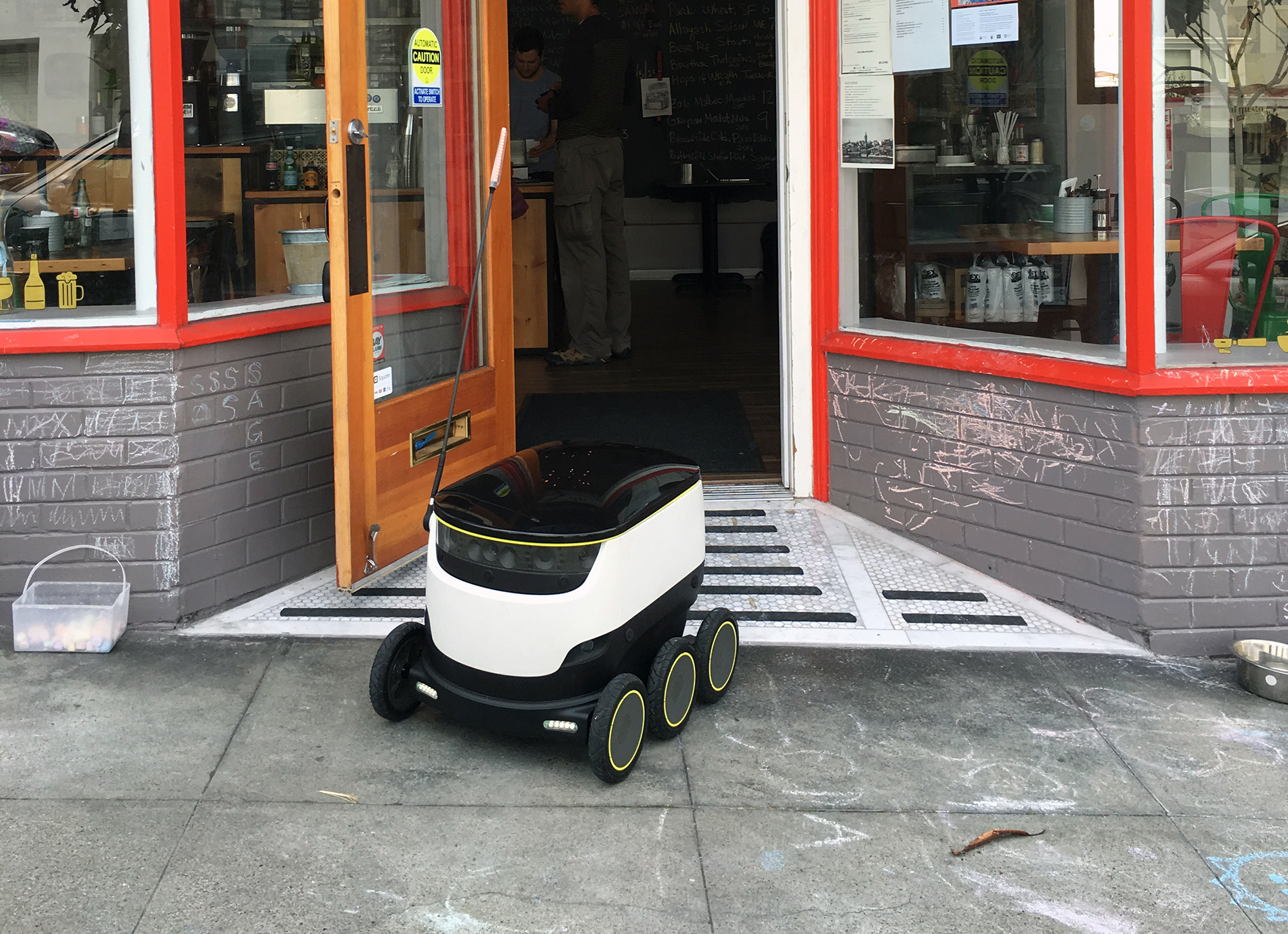 Starship Technology’s “friendly sidewalk robot” leaving Orson's Belly Cafe on Tuesday to make a delivery